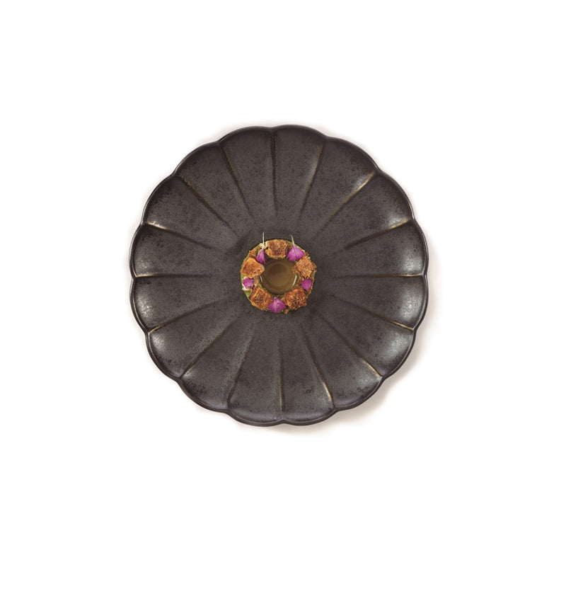 Artistic Dalia Plate with bold petal design, luxury black stoneware for statement dining presentations.