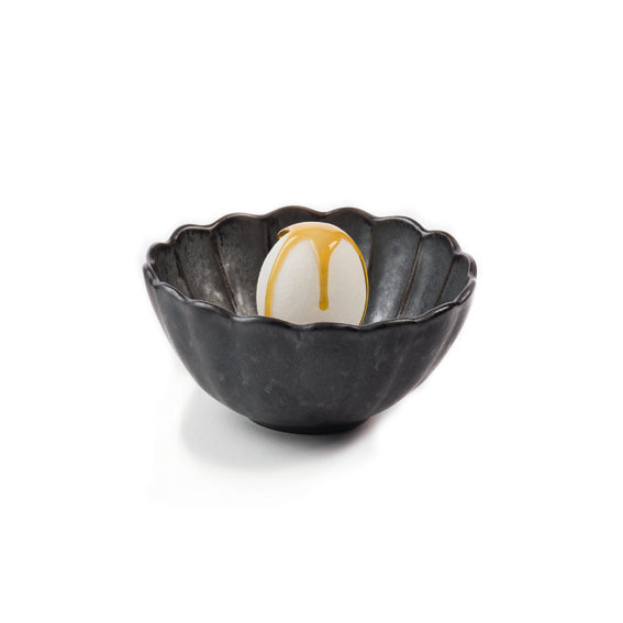 15.5cm black stoneware Dalia bowl with petal edges, textured finish, artistic serveware for salads, sides, or desserts.