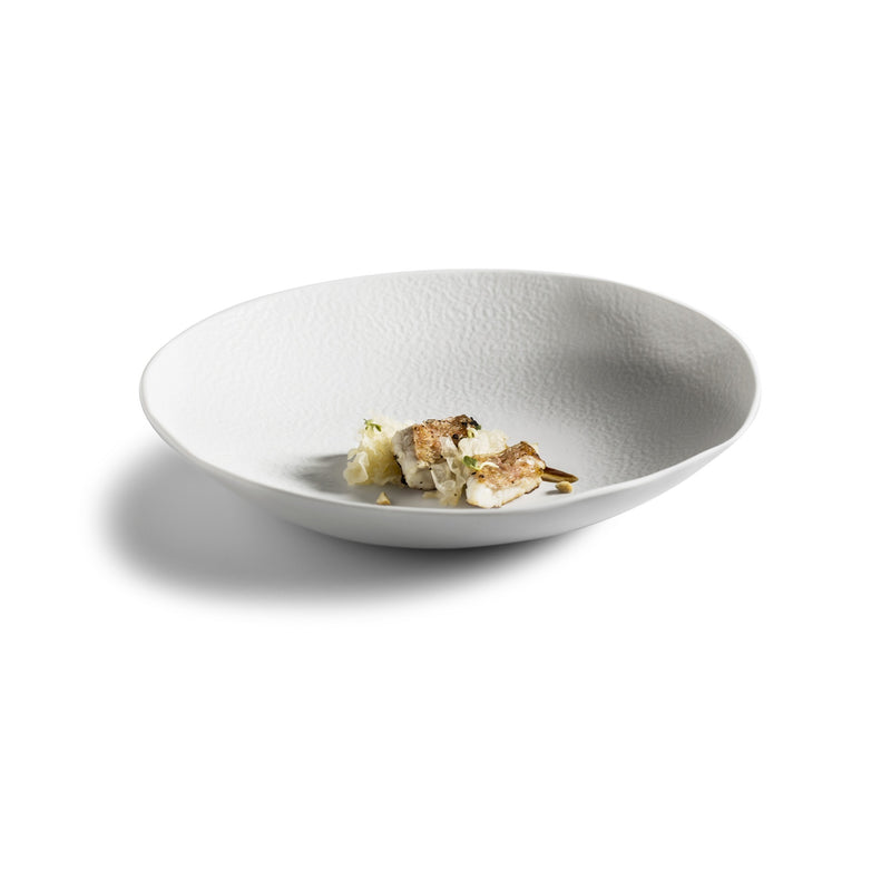 Artistic porcelain salad bowl with matte finish; luxury handmade tableware blending minimalist design with practical elegance.