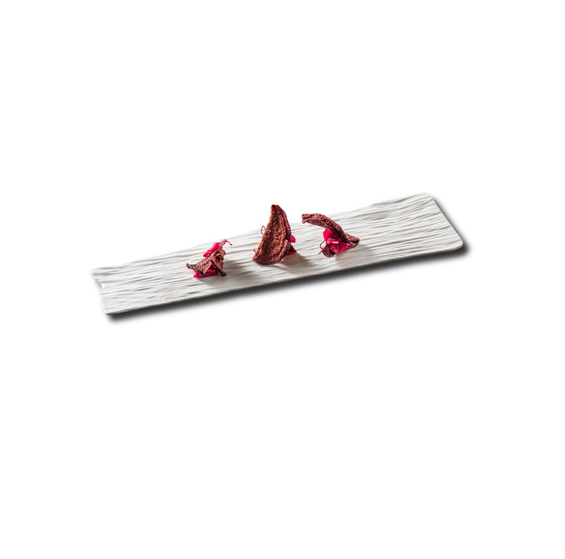 Artistic porcelain tray with matte tree-ring texture; luxury serving piece for elegant, nature-inspired culinary presentation.