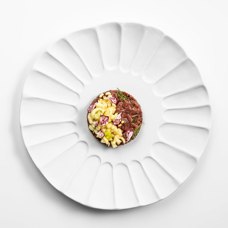 Lira plate in matte white porcelain with sculpted fluted design, luxury artistic tableware for elegant fine dining