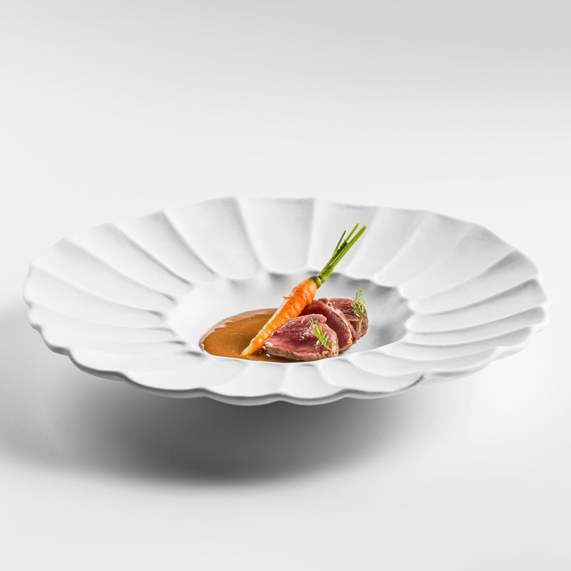 Lira deep plate in matte white porcelain with sculpted fluted design, luxury tableware for modern artistic fine dining
