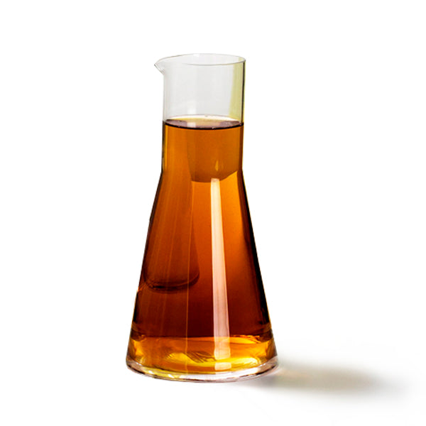 Amber glass jug 500ml with conical shape, glossy finish, heat-resistant, dishwasher and freezer safe, perfect for elegant table settings.