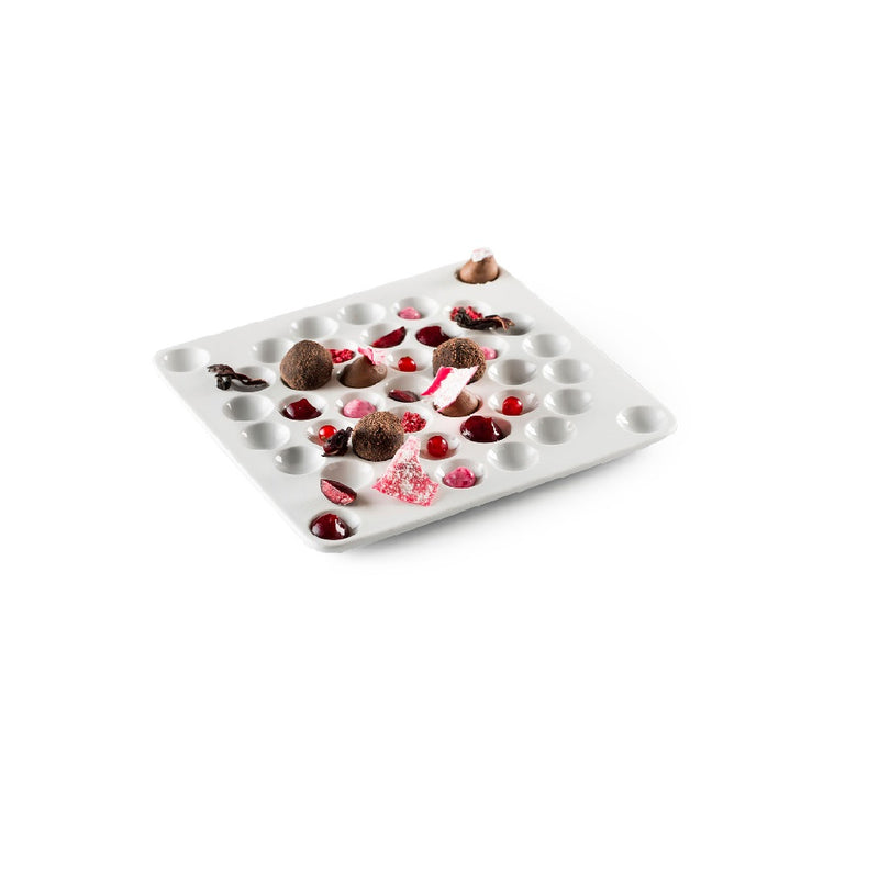 Artistic porcelain degustation tray with matte and glossy finishes; luxury hive-inspired design for creative food presentation.