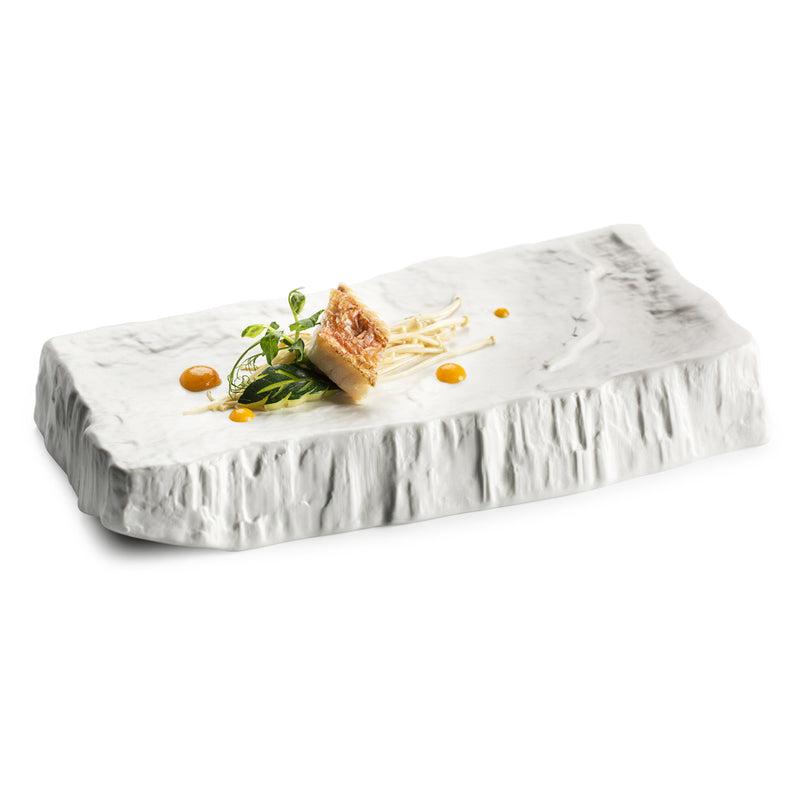 Porcelain Cliff Mat with raw textured edges, matte finish luxury serveware from Sublime Collection for artistic culinary display.