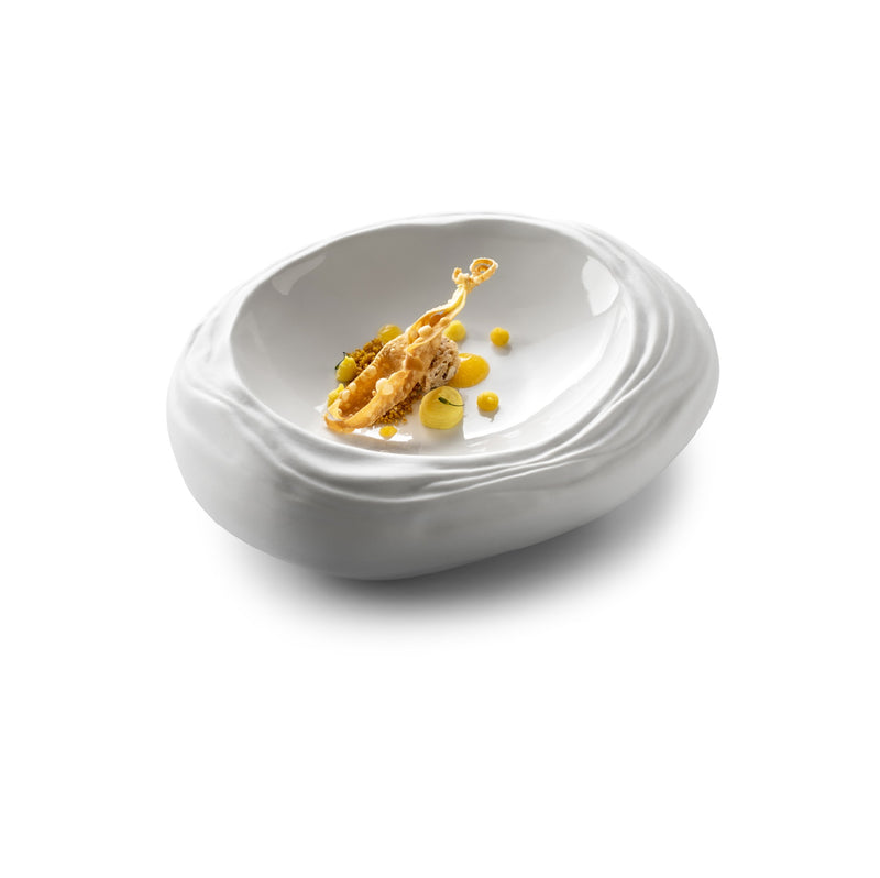 Luxury porcelain bowl with wave-like form, gloss-matte finish, artistic design inspired by Barcelona's coastal elegance.