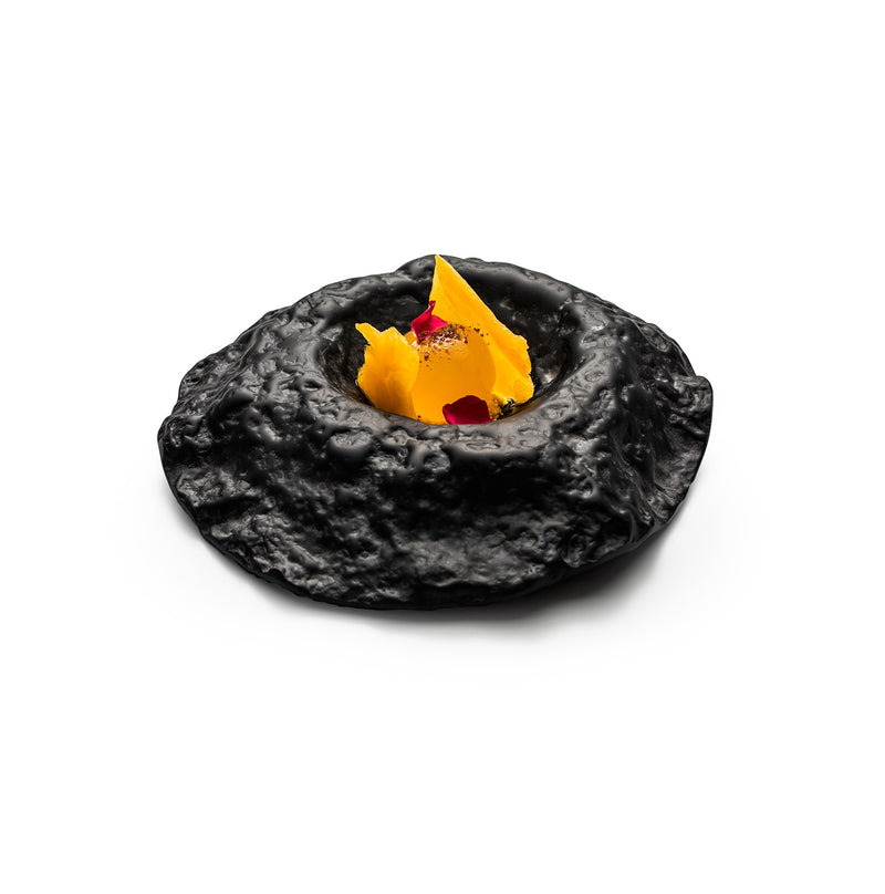 Crater glass bowl with lunar-inspired matte finish, luxury artistic serveware for creative dishes and elegant table settings.