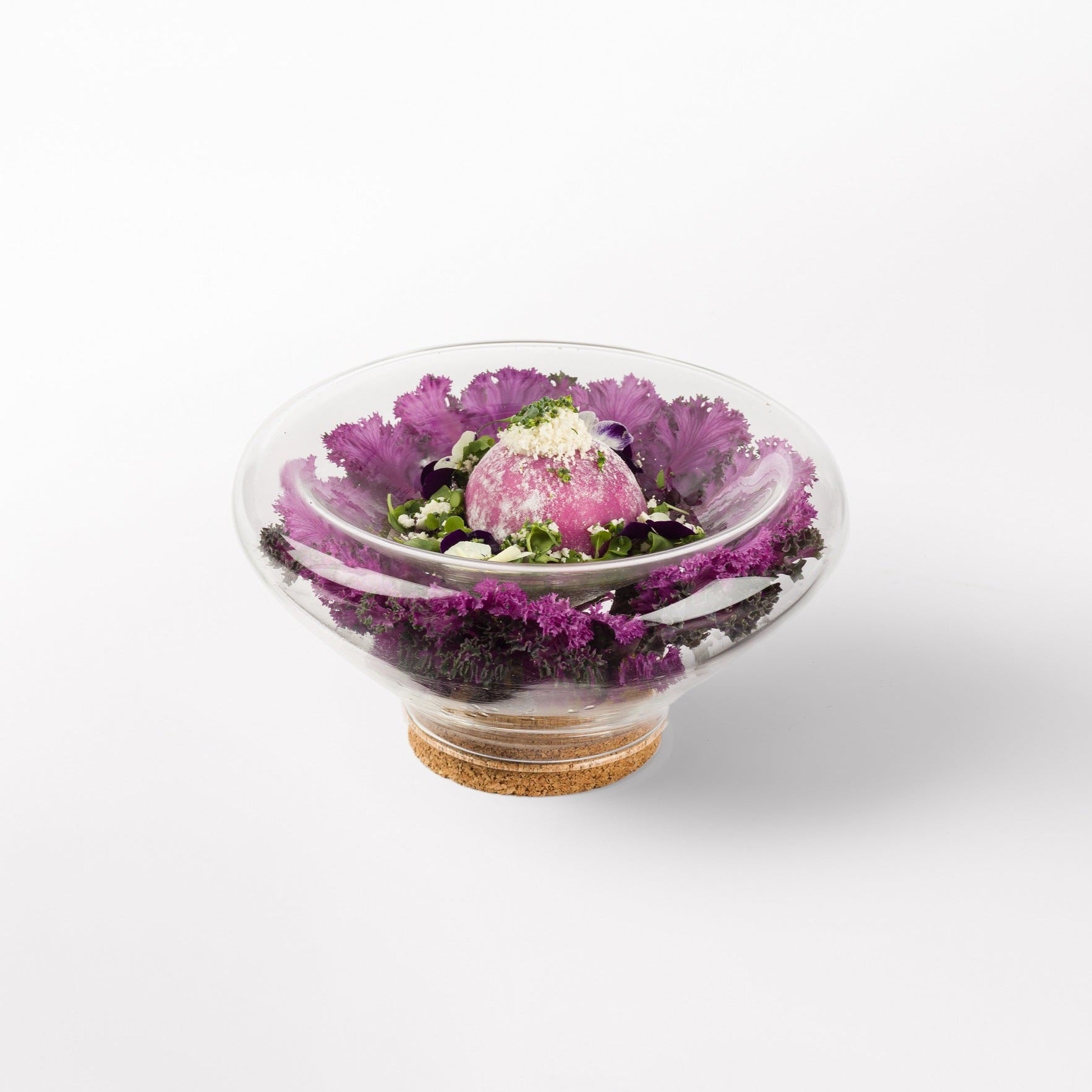 Transparent glass bowl with cork base, modern decorative design for flowers, stones, or sand display.