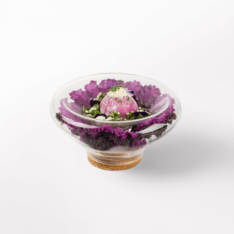 Transparent glass bowl with cork base, modern decorative design for flowers, stones, or sand display.